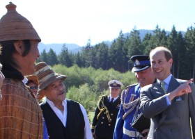 Prince Edward jokes with Ha'wilth Paul Tate as they greet each other at the helicopter