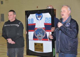 Peter Zebersky presents Panthers jersey to Rick Hanak, Tsawout First Nation operations manager.