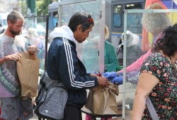 Lunch is distributed on East Hastings by one of the many service providers working to support people in the Vancouver neighbourhood.