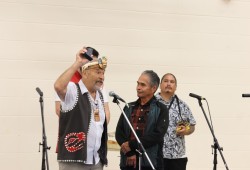 Haida Nation Hereditary Chief Gitkun speaks next to Tla-o-qui-aht carver Joe Martin.