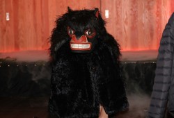 A bear mask was part of the event's storytelling, as the audience watched the creation narrative unfold.