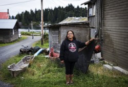 Janice John-Smith poses for a photo outside her home in Kyuquot, on August 14, 2020. 