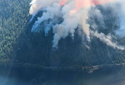 Burning in a steep mountainside slope, the Cameron Bluffs fire caused debris to fall onto Highway 4, leading the province to close the road for most of June. (B.C. Wildfire Management Branch photo)