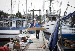 Charles Webster helps his cousin, Errol Sam, get his boat ready to head out commercial fishing in the Ucluelet harbour.