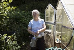 Dianne Ignace waters one of her greenhouses, on Wednesday, June 24, 2020.