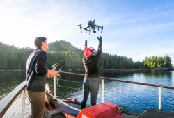 Team embers launching the drone. (Andrew Trites/ University of BC photo)