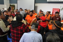 People gathered to sing the Nuu-chah-nulth song after the details were announced.