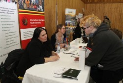 Denise Gallant (left) and Karen Sorensen of the B.C. First Nations Forestry Council attend to inquiries at the career fair. The council provides programs for Indigenous students interested in forestry and supports First Nations involvement in the industry. To attend to the current underrepresentation of Indigenous people in forestry, the council has set the goal of 2,200 jobs by 2027.