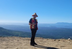 Harry Broussault, a Wit Wak guardian with Huu-ay-aht First Nations, overlooks Huu-ay-aht territory from Klanawa 332. (Submitted photo)