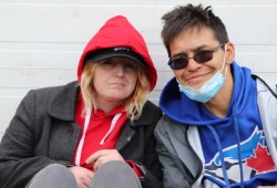 Matthew C. sits with a friend outside the Port Alberni Safe Injection Site on 3rd Avenue. (Denise Titian photo)