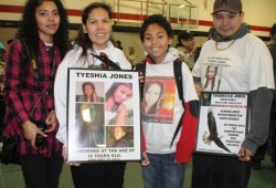 The family of Tyeshia Jones, who was murdered in 2011, holds pictures in her memory..