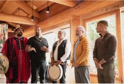 Hasheukumiss, Ahousaht’s acting Tyee Ha’wilth (far left), Chief Councillor n̓aasʔałuk, ʕaḥuusʔatḥ, Tyee Ha’wilth Maquinna Louis George and hereditary representative Tyson Atleo stand in the Tofino Wilderness Resort, a facility acquired by the First Nation’s hereditary chiefs in 2022 to expand their tourism offerings. (MHSS photo)