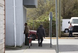 The budget allots $100 million over the next three years to deal with the drug overdose crisis. Pictured are people by Port Alberni's Safe Injection Site on Third Avenue. (Eric Plummer photo)