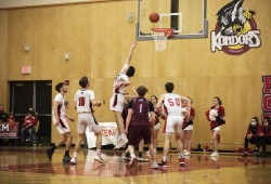 The Alberni District Secondary School Armada senior boys' basketball team play against the Kwalikum Kondors senior boys' high school basketball team at the 66th annual Totem Tournament, in Port Alberni, on March 10, 2022.