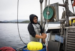 Laurence Curley, 17, works his first season as a commercial fisherman aboard the "Nellie Mona," on July 22, 2020. (Photograph by Melissa Renwick)