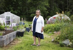Linda Thomas stops by the Tseshaht community garden in Port Alberni. Through her work with Usma Family and Child Services, she is aiming to connect the youth to the garden in hopes that they might be inspired to grow one of their own.