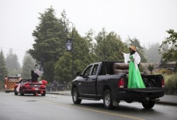 Roshelle Bob waves to Ucluelet community members who lined the streets to celebrate the high school graduates.