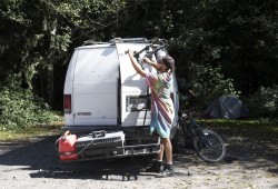 Pierre Dupont packs up his campsite on the side of West Main Forest Service Road, near Tofino, on August 10, 2021. 