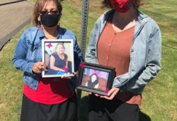 Young's aunt Carol Frank and MLA Sheila Malcolmson hold pictures of the missing Tla-o-qui-aht woman.