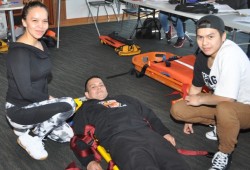 From right to left, Natasha Marshall, "victim" Colin Mack and Lonnie McPhee after completing an exercise.