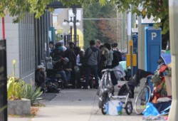 On Pandora Avenue in downtown Victoria a hive of activity fills the sidewalk in front of the safe drug injection site