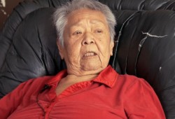 Patsy Nicolaye, pictured in a film documenting the early stages of the big house project, is among the elders who identified the need for the project. (Kyuquotbighouse.com video image)