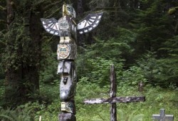 A totem pole carved by Arthur Nicolaye stands within the Kyuoquot cemetery on Mission Island. It was made in honour of his grandson, the late Edward Jackson.