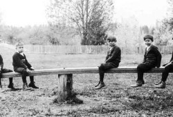 Children are pictured on a teeter totter at the Alberni Indian Residential School. (United Church of Canada archives) 