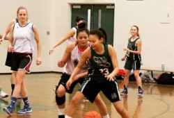 Anna Atleo, in the white jersey, plays defense against her daughter Janessa. (Submitted photo)