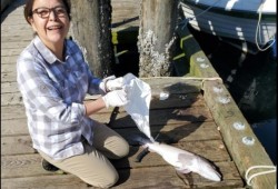 Anne Atleo fillets a ling cod. (June Titian photo)