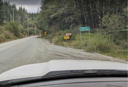 A ‘Bamfield KEEP LEFT’ sign sits at Hawthorne Main on the route from Port Alberni to Nitinaht. (Submitted photo)