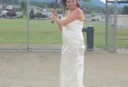 Camille Hamel, coach for the Master Batters, plays baseball on her wedding day. (Submitted photo)