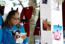 Carol Frank, Lisa Marie Young's aunt, speaks to a crowd of supporters at Maffeo Sutton Park on June 30 for the annual walk for Lisa Marie Young. 