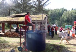 Ezri Jack, 8, takes a shot at dunking her dad HFN Chief Councillor John Jack.