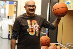 ADSS senior girls head coach Neelam Parmar palms a basketball.
