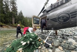 Jessica Moffatt, Mack Bartlett and Keaton McCallum collect gear used in a salmon sampling operation in the Kaouk River. (Robertson Creek Hatchery photo)