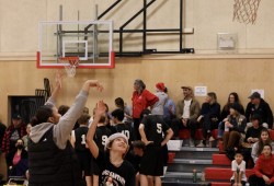 Ucluelet Secondary Warrior Jaysen Touchie reaches into the cookie jar during halftime of the On the Edge Basketball tournament final.