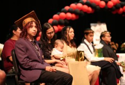 Eli Ginger sits with other Huu-ay-aht graduates on June 7, 2025 at ADSS.