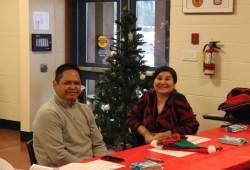 Kevin Titian of Usma Nuu-chah-nulth Child and Family Services and Gina Amos, a harm reduction worker with Teechktl Mental Health, await visitors to the Feed the People gathering on December 14 at the Alberni Athletic Hall. 