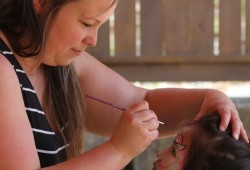 Alayah Tizya, who is visiting from the Yukon, gets her face painted by Lana Cherie at the Port Alberni Friendship Center on June 21. (Eric Plummer photo)