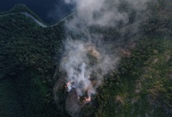 The Cameron Bluffs wildfire started in early June 2023, burning for several weeks as the adjacent highway faced shutdowns and severe delays. (BC Wildfire Service photo) 
