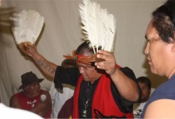 Walter Thomas leads a song during a potlatch honouring the late Darrell Campbell on Aug. 26, 2017 in Ahousaht. (Denise Titian photo)