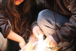 Darryl McCarthy and Jordan Touchie work on starting a fire in the woods near Zeballos on May 24, preparing for a challenge in the 2025 Warrior Games. (Eric Plummer photo)