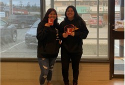 Jenniece and Miranda Mack proudly display their new N plates after passing a driver’s test. (Ricardo Manmohan photo)