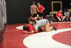 Alex Edgar grapples with an opponent during practice.