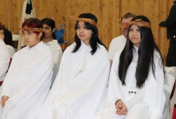 The event started with an aitstuthla, or coming of age ceremony, for the young women of the Cook house. Yał luu a’s speaker told the crowd that the ha’wilth was standing up the young ladies as adults on that day.