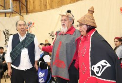 Before retiring from 35 years as First Nation’s second chief, Yał luu a (left) stood up the young women of his house, giving them names. Also pictured is Yał luu a's speaker, Haa’yuups, and his daughter, Sherri Cook, who now carries the name Yał luu a after the transfer of chieftainship.