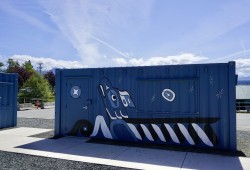 An eagle, designed and painted by Tseshaht artist Gordon Dick and Shayne Lloyd, is displayed on one of the new sea cans at Clutesi Haven Marina. (Karly Blats photo)