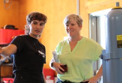 Barkley Project Group’s Kass Harbottle, left, shows MLA Josie Osborne how the powerhouse produces power.