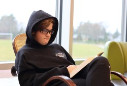 Kellen Brown reads a book in the Ucluelet Secondary School's library.